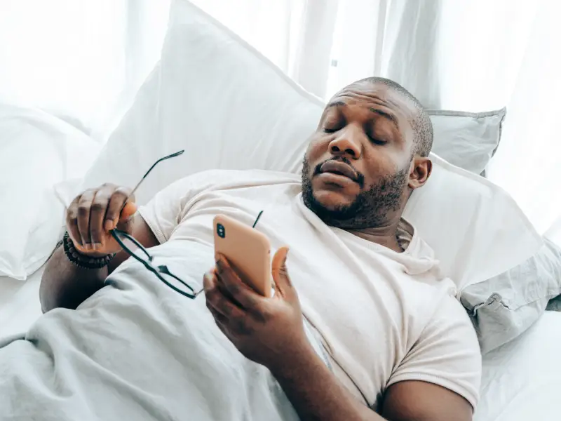 10 Tips for Better Sleep 1 sleeping with mobile